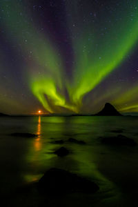 Scenic view of sea against sky at night