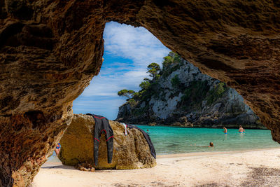 Natural cave in menorca righe in the sea