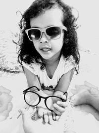 Portrait of smiling girl wearing sunglasses