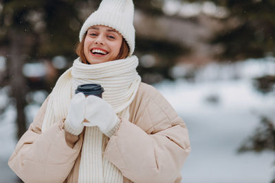 Portrait of young woman wearing warm clothes