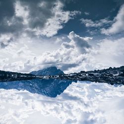 Scenic view of sea against cloudy sky