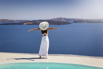 Rear view of woman looking at sea