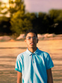 Portrait of man standing at beach