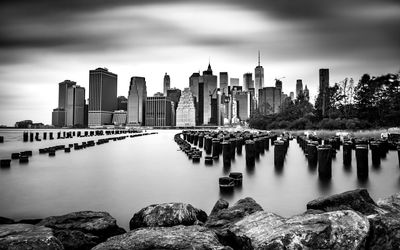 View of skyscrapers against cloudy sky