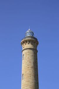 Low angle view of tower against clear blue sky
