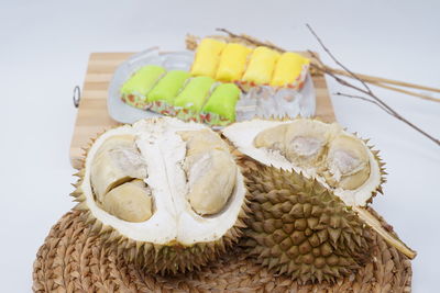 Close-up of cake on table against white background