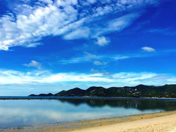 Scenic view of lake against blue sky