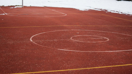 Empty basketball field in winter