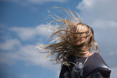 Portrait of teenage girl jumping on trampoline