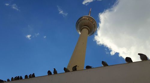 Low angle view of building against cloudy sky