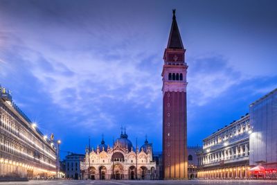 Illuminated town square at dusk