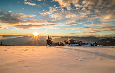 Scenic view of beach against dramatic sky