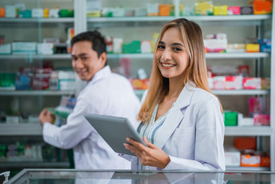 Portrait of female doctor standing in supermarket