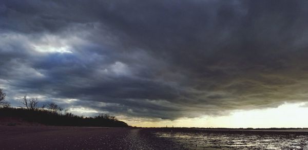 Scenic view of dramatic sky over land