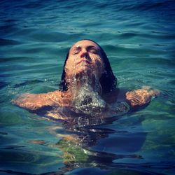 Woman swimming in sea