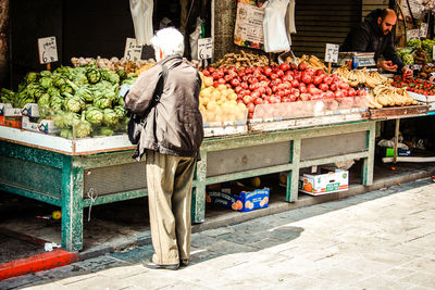 Rear view of fruits for sale in market