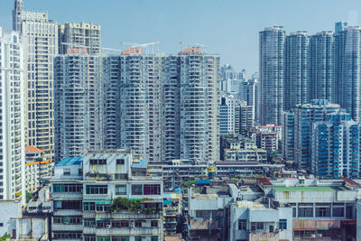 Modern buildings in city against sky