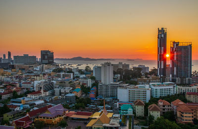 Cityscape against sky during sunset