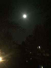 Low angle view of illuminated dark dark sky