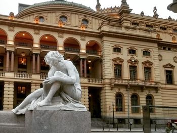 Low angle view of statue against building