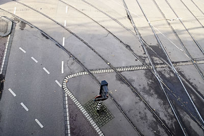 High angle view of person walking on footpath