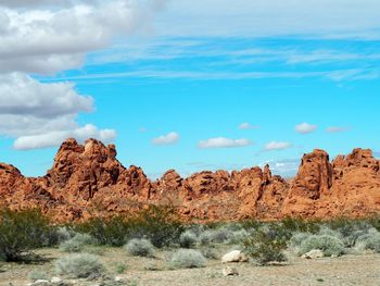 Rock formations on landscape against sky