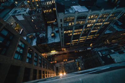 Low angle view of illuminated buildings at night