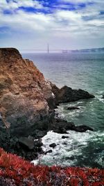 Scenic view of sea against cloudy sky