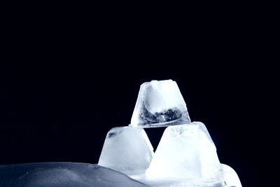 Close-up of ice over black background