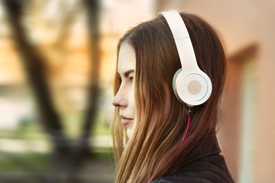 Portrait of young woman outdoors