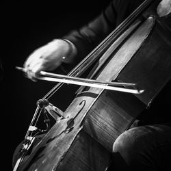 Close-up of man playing piano