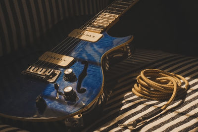 High angle view of guitar on table