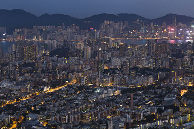 Aerial view of illuminated buildings in city at night