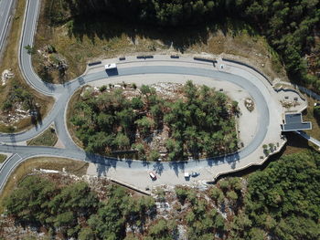 High angle view of road by trees in city