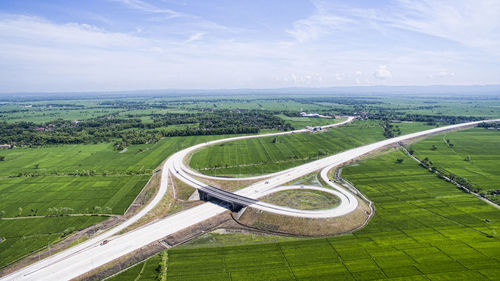 High angle view of agricultural landscape against sky