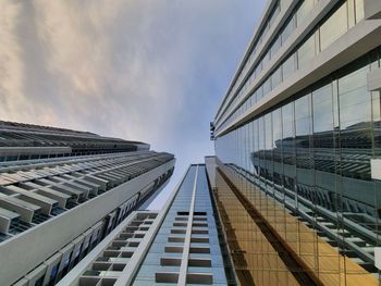 Low angle view of modern buildings against sky