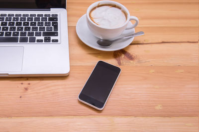 High angle view of coffee cup on table