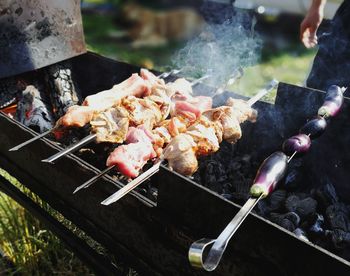 High angle view of meat on barbecue grill