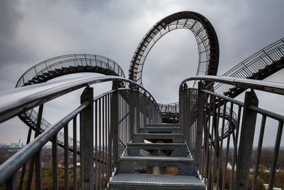 Low angle view of ferris wheel against sky