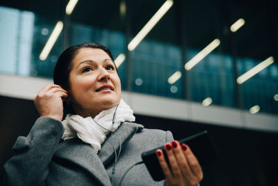 Portrait of woman using mobile phone