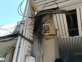 Low angle view of telephone pole against clear sky