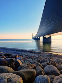 Scenic view of sea against clear sky at sunset