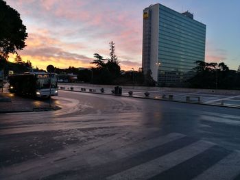 View of city street at sunset