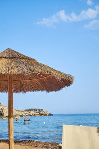 Built structure on beach against sky