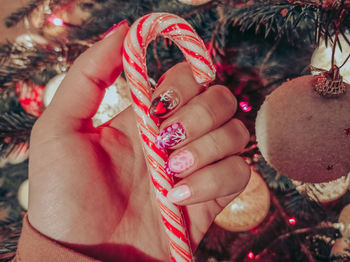 Midsection of woman holding christmas decorations