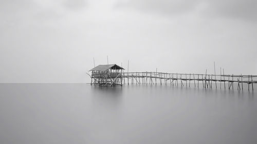 View of pier over sea against sky