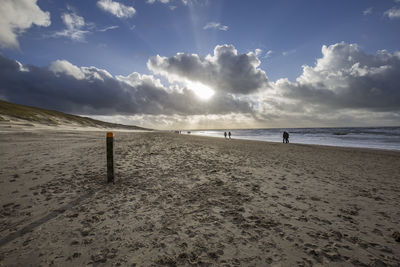 Scenic view of beach against sky at egmond