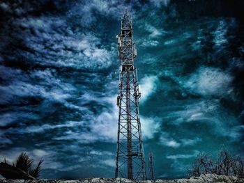 Low angle view of communications tower against sky