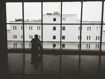 Woman standing in front of building