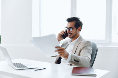 Businesswoman working at desk in office